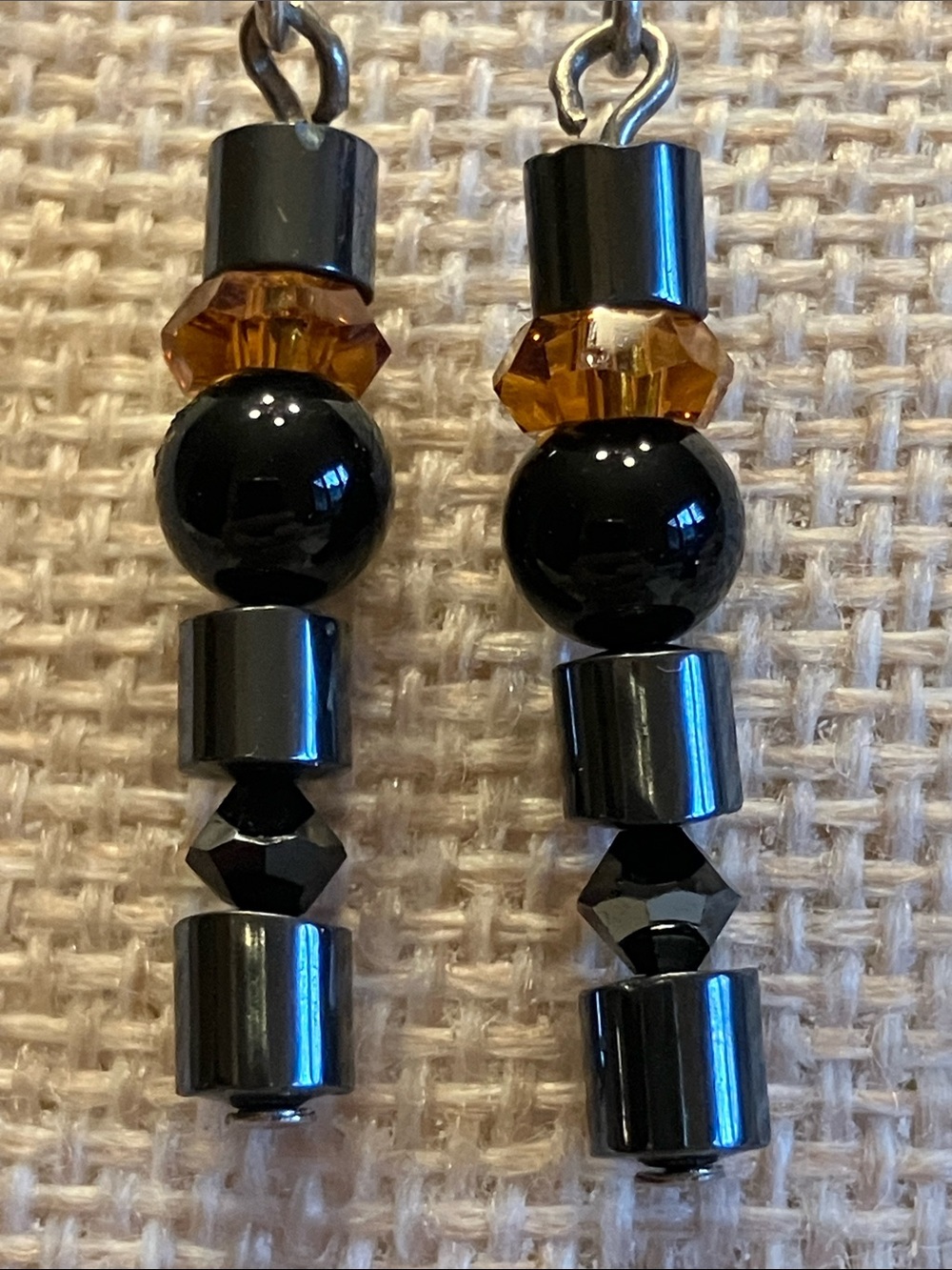 METALLIC HEMATITE ON STERLING SILVER EARRINGS WITH  AMBER COLORED CRYSTAL ACCENT